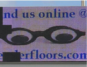 LED billboard showing web address and email