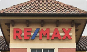 REMAX sign on tile roof
